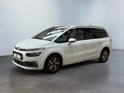 the white citrole is parked in a white room