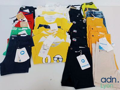 a lot of children ' s clothing on display on a table