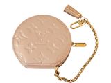 a close up of a coin purse with a chain around it