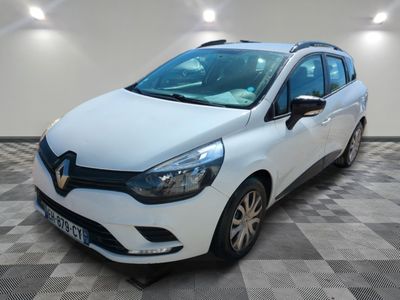 the white car is parked on a checkered tile floor
