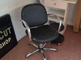 a desk and chair in the corner of a room