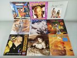 a lot of various cd ' s on the table