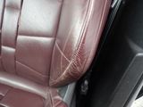 a close up of a leather seat in a car