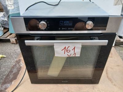 a black and silver oven with a price tag on it
