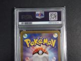 the pokemon card is in a clear plastic holder on a table