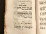 a book open on a table with a black background