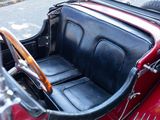 a close up of a red car with a steering wheel