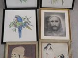 four framed pictures of a man with a bird, a woman with a parrot, and a woman with a parrot