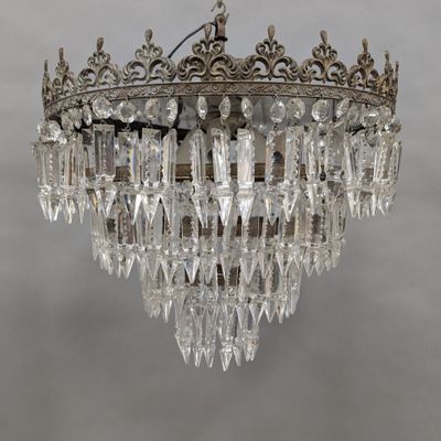 a close up of a crystal chandelier hanging from a ceiling