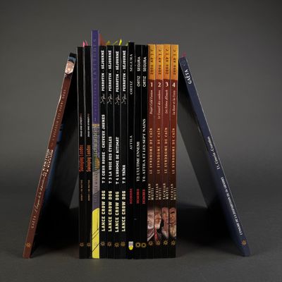 books stacked on top of each other on a gray surface
