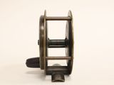 a close up of a reel on a white surface with a white background