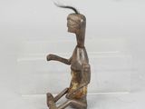 bronze figurine of a man with a baseball bat in his hand