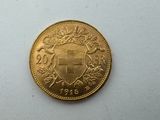 a close up of a gold coin on a white surface