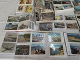 a lot of cards on a table with a lot of them