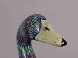 a colorful bird that is sitting on a table