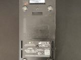 a close up of a black electronic device on a table