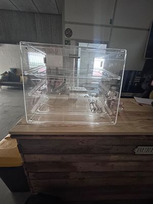 a clear box on top of a wooden table
