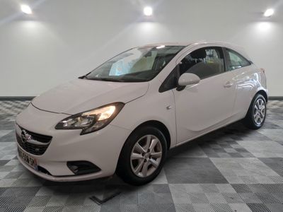 a picture of a white car parked in a garage