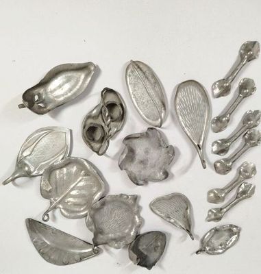 a lot of silver spoons and spoon spoons on a white surface