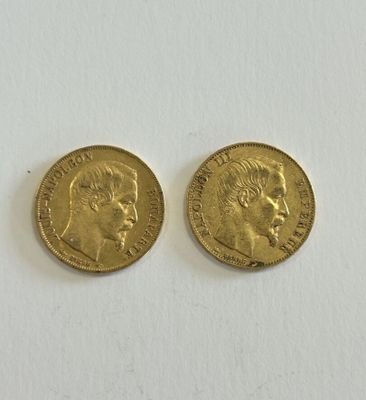two gold sovereigns, one with the head of a woman and one with a man ' s face