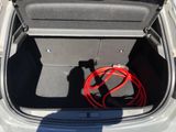 a red hose in the trunk of a car