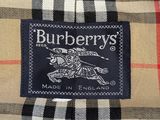 a close up of a burberry ' s shirt with a tag on it