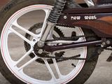 a close up of a motorcycle with a chain attached to it