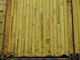 a yellow container sitting on top of a blue container