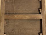 an old picture of a wooden frame with a label on it