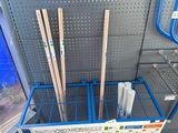 four skis that are sitting in a blue cart