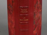 a red book that is open on a table