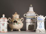 many different types of vases on display on the table