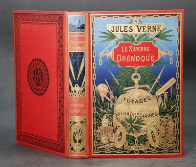 un vieux livre à la couverture rouge et à la bordure dorée