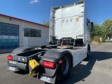 a truck that is parked in front of a building