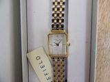 a watch that is sitting in a box with a tag