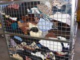 a large metal cart with a lot of clothes on it