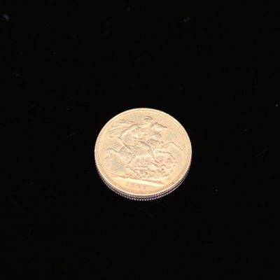 a close up of a coin on a black surface