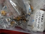 a plastic container filled with assorted items on the floor