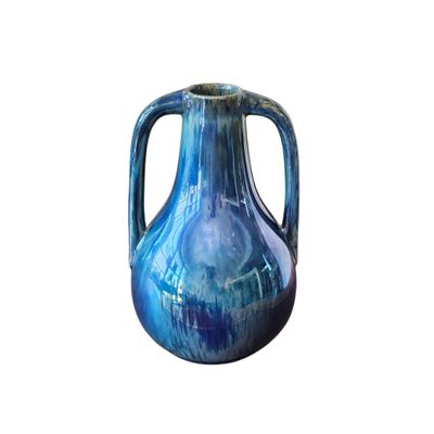 a blue vase with a handle on a white background
