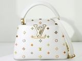 un sac Louis Vu blanc orné d'étoiles multicolores