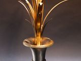 an image of a table lamp with a metal base and a gold colored shade