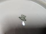 a close up of a white plate with black writing on it
