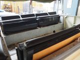 a long row of seats in the back of a bus