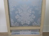 a chair with a blue and white floral pattern on it