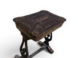 an old wooden table with a carved top on a white background