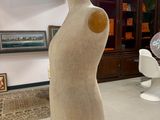 a mannequin on a stand in a room