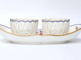 pair of white and blue dishes with flowers on them