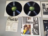 two black and white records on a table with pictures