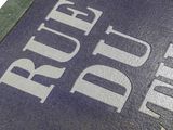 a close up of a blue book with white writing on it