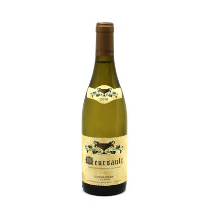 the bottle of white wine is sitting on a white surface